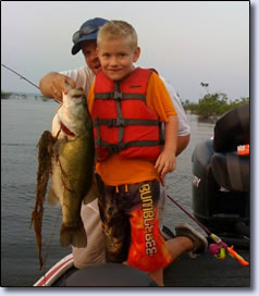 Chip Buchanan and Dad with Chip's 8 lbs bass 